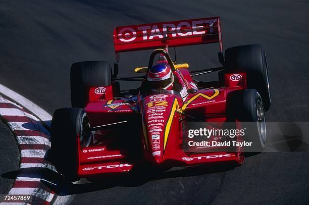 Driver Jimmy Vasser of the USA and team Target Ganassi racing in action on the course as he negotiates a turn in his Reynard Honda R961 race car...