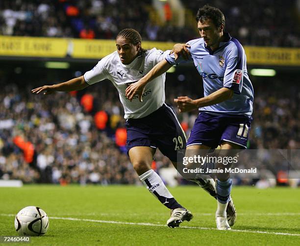 Phillip Ifil of Tottenham Hotspur holds off Jeff Smith of Port Vale during the Carling Cup Fourth Round match between Tottenham Hotspur and Port Vale...