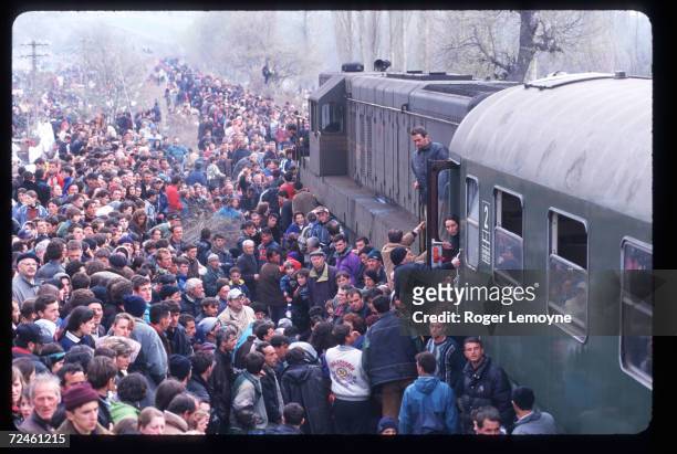 Crowd of refugees prepare to board trains April 1, 1999 in Macedonia. Thousands of Kosovar Albanians fled the violence in Serbia and arrived at...