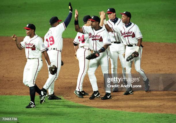 The Atlanta Braves celebrates in the field during the National League Championship Series game one against New York Mets at Turner Field in Atlanta,...