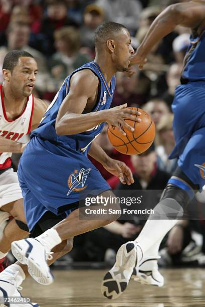 Chris Whitney of the Washington WIzards takes the ball down the court past Damon Stoudamire of the Portland Trail Blazers during a game at the Rose...