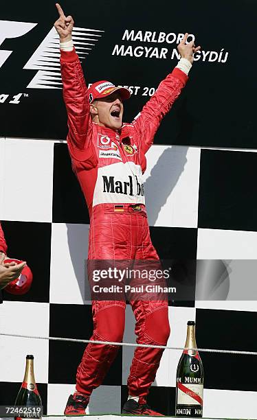 Michael Schumacher of Germany and Ferrari celebrates winning the Hungarian F1 Grand Prix at the Hungaroring Circuit on August 15 in Budapest,...