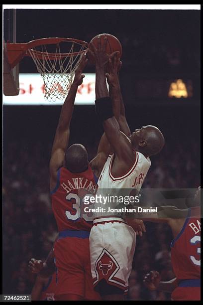Guard Michael Jordan of the Chicago Bulls goes up for two during a game against the Philadelphia 76ers at the United Center in Chicago, Illinois. The...