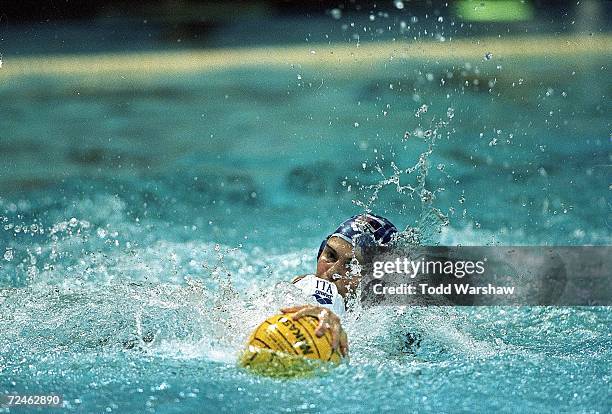 Tania Di Mario Team Italy grabs the ball as Sofia Konoukh of Team Russia pushes her down during the FINA World Cup at the Pan Am Pool in Winnepeg,...