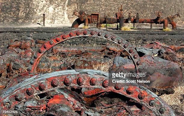 An oil collection facility lies in ruins at the giant Burgan oil field January 13, 2003 in Central Kuwait. The oil field, the largest in the world,...