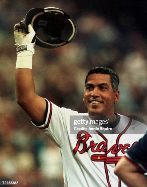 Andres Galarraga of the Atlanta Braves reacts after fans cheer his return from Cancer during Monday''s opening day game against the Colorado Rockies...