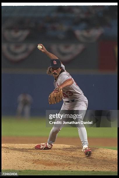 Dennis Eckersley of the St. Louis Cardinals throws the ball during a playoff game against the Atlanta Braves at Fulton County Stadium in Atlanta,...