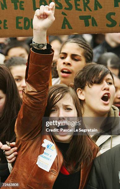 An unidentified high school student gestures during a demonstration to protest against government plans to reform the education system on March 8,...