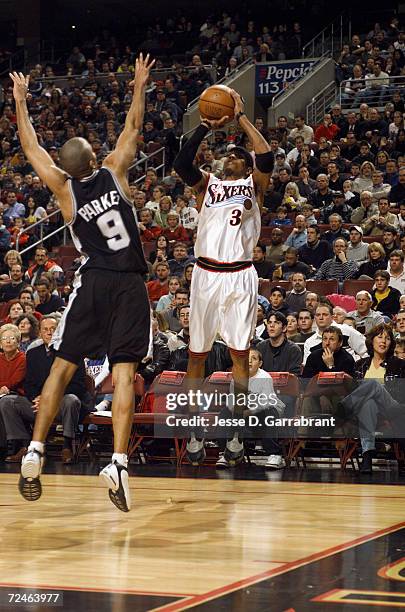 Guard Allen Iverson of the Philadelphia 76ers shoots the ball as guard Tony Parker of the San Antonio Spurs attempts to block during the NBA game at...