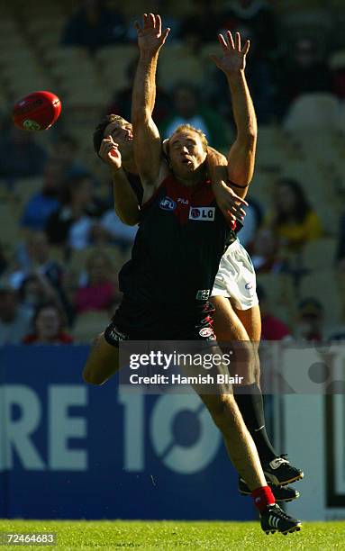 David Neitz for Melbourne flies for the ball in front of Darryl Wakelin for Port Adelaide, during the Round 2 AFL Match between the Melbourne Demons...