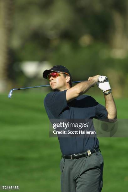 Actor David James Elliott hits a shot on the 16th hole during the opening round of the Bob HopeChrysler Classic at Indian Wells Country Club in La...