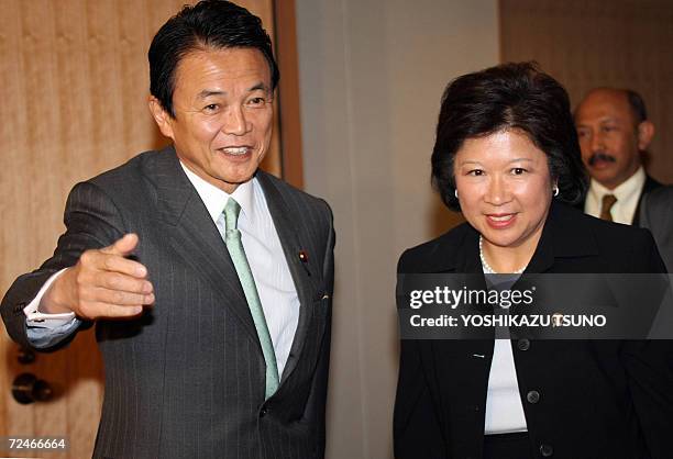 Indonesian Trade Minister Mari Elka Pangetsu is greeted by Japanese Foreign Minister Taro Aso for their talks at Aso's office in Tokyo, 09 November...