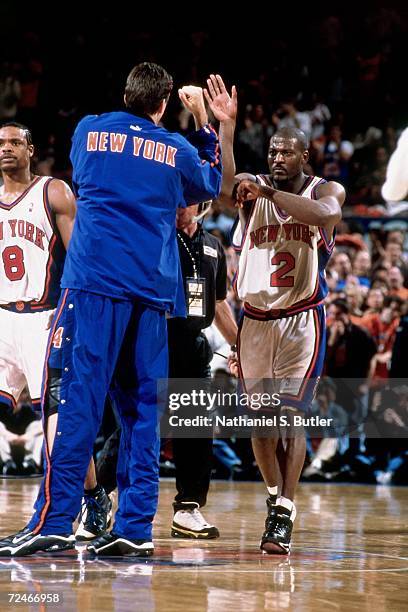 Larry Johnson of the New York Knicks celebrates after he hit a three-point basket to give the Knicks a 88-85 lead over the Toronto Raptors during...