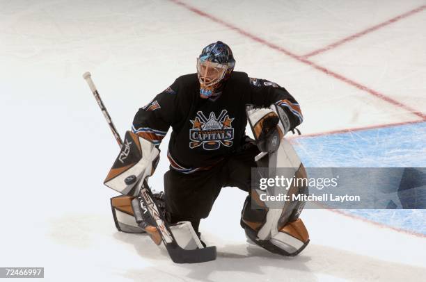 Olie Kolzig of the Washington Capitals looks to make a blocker save during a NHL hockey game against the Atlanta Thrashers at the Verizon Center...