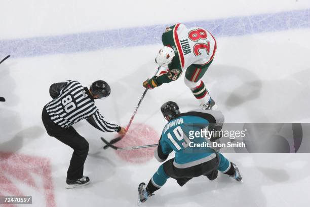 Joe Thornton of the San Jose Sharks readies for a faceoff with Todd White during a game against the Minnesota Wild on October 21, 2006 at the HP...