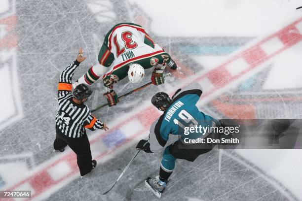 Joe Thornton of the San Jose Sharks readies for a faceoff with Wes Walz during a game against the Minnesota Wild on October 21, 2006 at the HP...