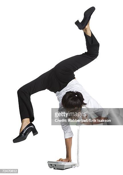 female contortionist businesswoman - businesswoman handstand stock pictures, royalty-free photos & images