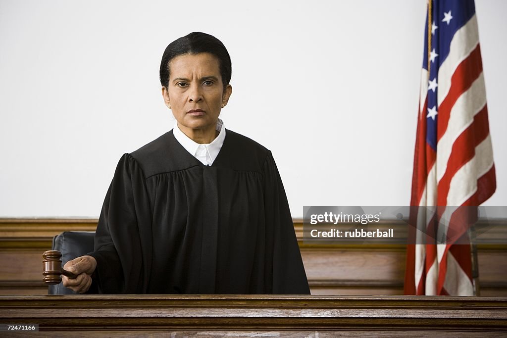 Portrait of a female judge holding a gavel