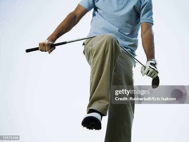 man breaking a golf club - broken golf club stock pictures, royalty-free photos & images