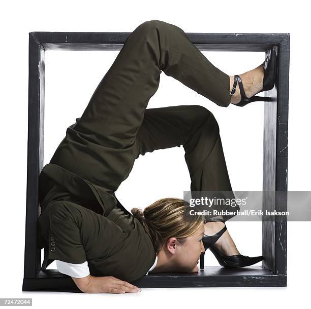 female contortionist businesswoman inside the box - young contortionist stockfoto's en -beelden