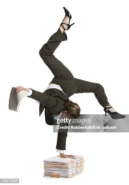 female contortionist businesswoman - businesswoman handstand stock-fotos und bilder