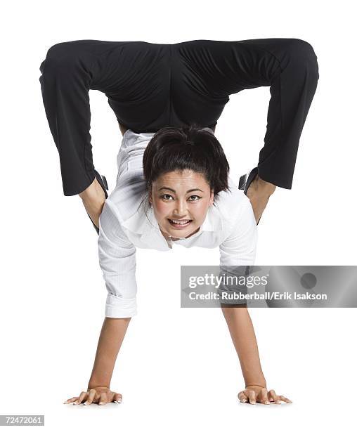 female contortionist businesswoman - businesswoman handstand stock pictures, royalty-free photos & images