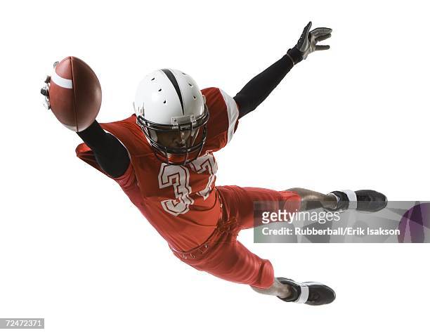 football player - american football player studio stock pictures, royalty-free photos & images