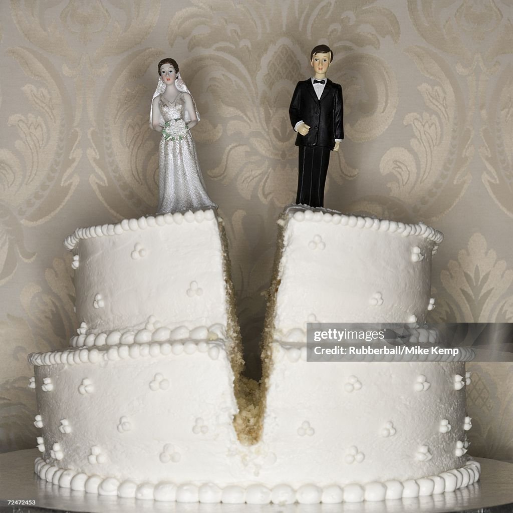 Wedding cake visual metaphor with figurine cake toppers