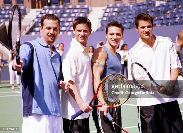 Teen sensation 98 Degrees, from Left, Justin Jeffre, Jeff Timmons, Drew Lachey and Nick Lachey attend the Arthur Ashe Kid's Day Family and Music...