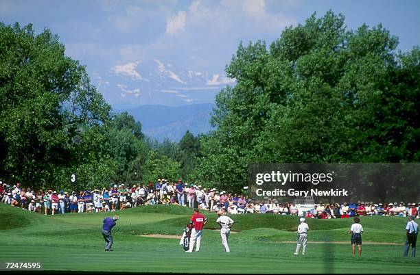 Arnold Palmer hits a chip shot onto the third green of the Cherry Hills Golf Course in Englewood, Colorado during the 1993 U.S. Senior Open....