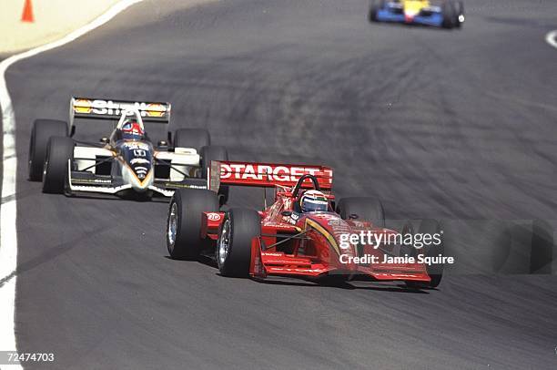 Driver Alex Zanardi of Italy and team Target Ganassi Racing negotiates the final straight away in his Reynard Honda R961 race car just ahead of Bryan...