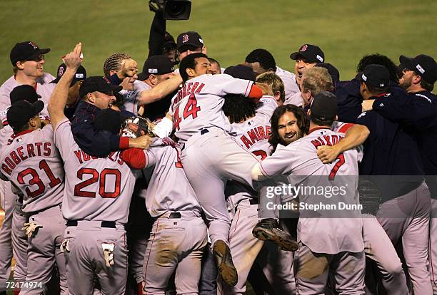 The Boston Red Sox celebrate after defeating the St. Louis Cardinals 3-0 to win game four of the World Series on October 27, 2004 at Busch Stadium in...