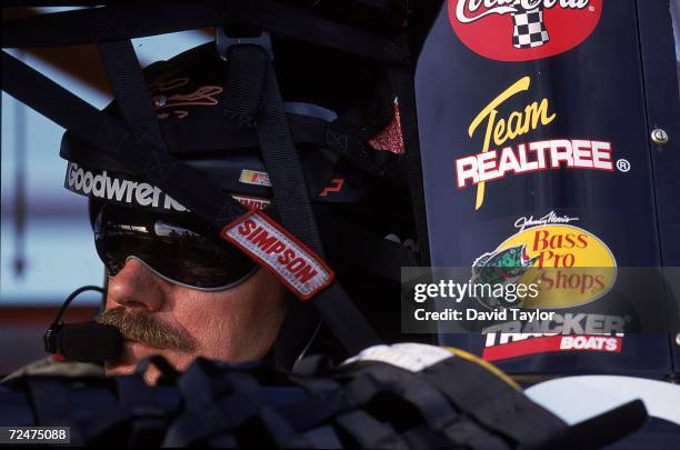 Dale Earnhardt sits ready in his car during the Pennzoil 400, part of the NASCAR Winston Cup Series at the Homestead - Miami Speedway in Homestead,...