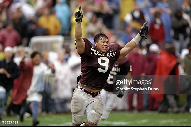 Linebacker Dat Nguyen of the Texas A&M Aggies gestures during the game against the Missouri Tigers at Kyle Field in College Station, Texas. The...