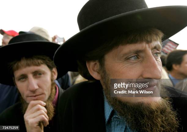 Two Amish men listen to U.S. President George W. Bush speak to supporters during a campaign rally at Lancaster Airport October 27, 2004 in Lancaster,...