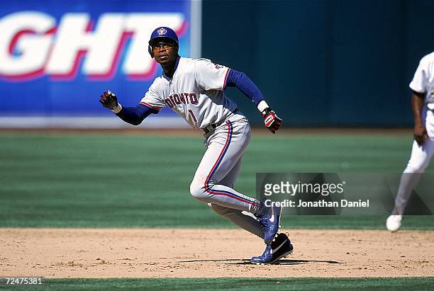 Tony Fernandez of the Toronto Blue Jays runs to a base during a game against the Oakland Athletics at the Network Coliseum in Oakland, California....