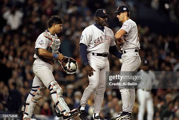 Pitcher Kevin Brown, Dave Stewart and catcher Carlos Hernandez of the San Diego Padres confer on the mound during during the 1998 World Series Game 1...