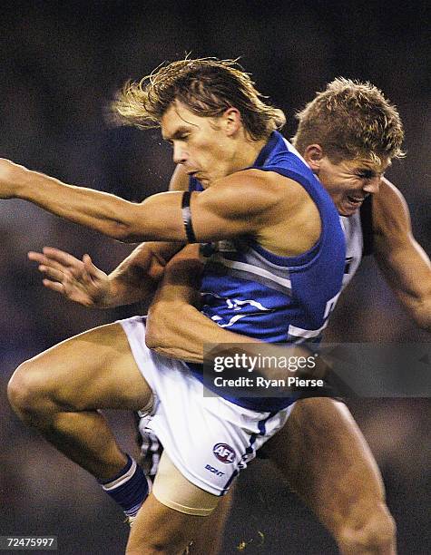 Jess Sinclair for the Roos clashes with Cameron Cloke for the Magpies during the round ten AFL match between The Kangaroos and the Collingwood...