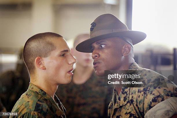 Marine recruit Derrick Powers of Revere, Massachusetts gets some personal attention from his drill instructor GYSgt. Gregory Mitchell of East Point,...