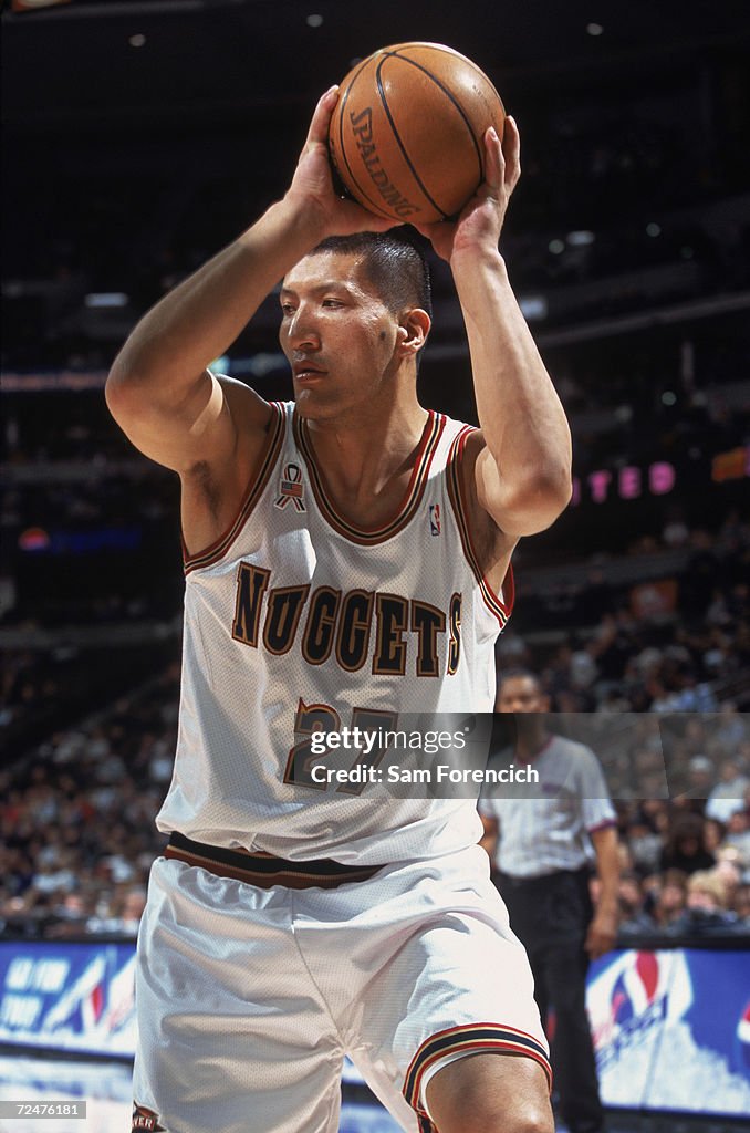 Mengke Center Mengke Bateer of the Denver Nuggets holds the ball during the ...