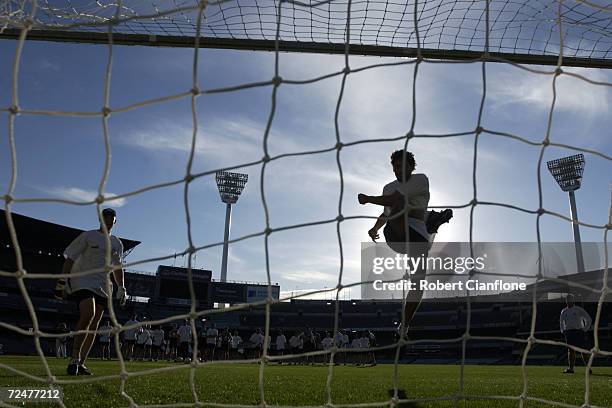 Darryl White of the Australian International Rules Team blasts a shot into the goals during this afternoons training session, in preperation for...