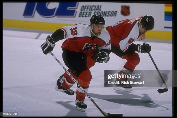 Philadelphia Flyers defenseman Shawn Antoski and rightwinger Mikael Remberg moves down the ice during a game against the Buffalo Sabres at Memorial...