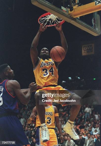 Shaq Rim Break Center Shaquille O'Neal of the Los Angeles Lakers hangs from the rim ...