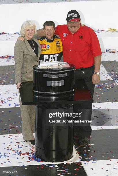 Ward Burton driver of the Bill Davis Racing Dodge Intrepid R\\T celebrates with team onwers Bill and Gail Davis after winning the 44th NASCAR Winston...