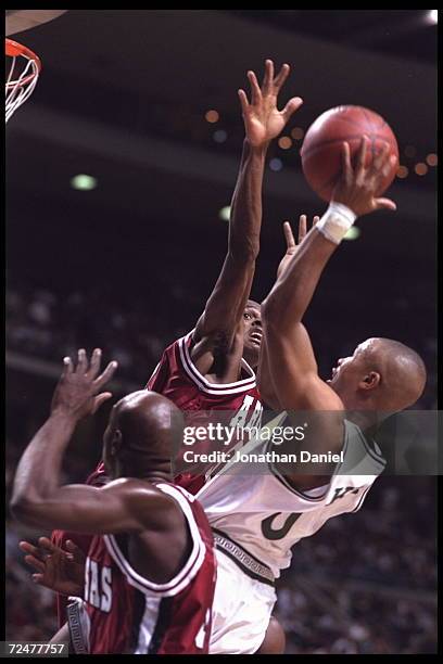 Forward Derek Hood of the Arkansas Razorbacks blocks a shot by a Michigan State Spartan player at The Palace in Auburn Hills, Michigand during the...