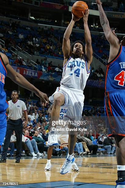 Andre Miller of the Cleveland Cavaliers drives to the basket against Kurt Thomas of the New York Knicks at the Gund Arena in Cleveland, Ohio. DIGITAL...