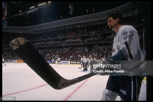 Stu Grimson of the Anaheim Mighty Ducks looks on during a game against the Edmonton Oilers at Arrowhead Pond in Anaheim, California. The Ducks won...