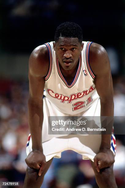 Dominique Wilkins of the Los Angeles Clippers takes a break during a foul shot against the Charlotte Hornets at The Los Angeles Sports Arena on March...