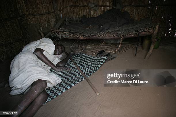 Sick elderly Sudanese refugee man rests in his shelter on November 8, 2006 in the Goz Amer Refugee Camp, Chad. Since 2004 refugees have fled from...