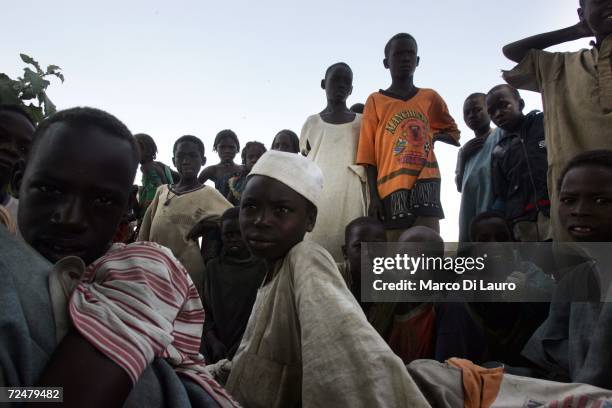 Chadian villagers find shelter under trees after an attack on their village forced them to flee on November 9, 2006 in a camp for internally...